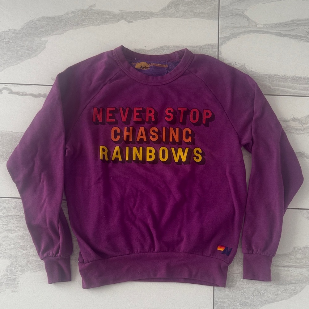 Vibrant Purple Sweatshirt with Inspirational Text